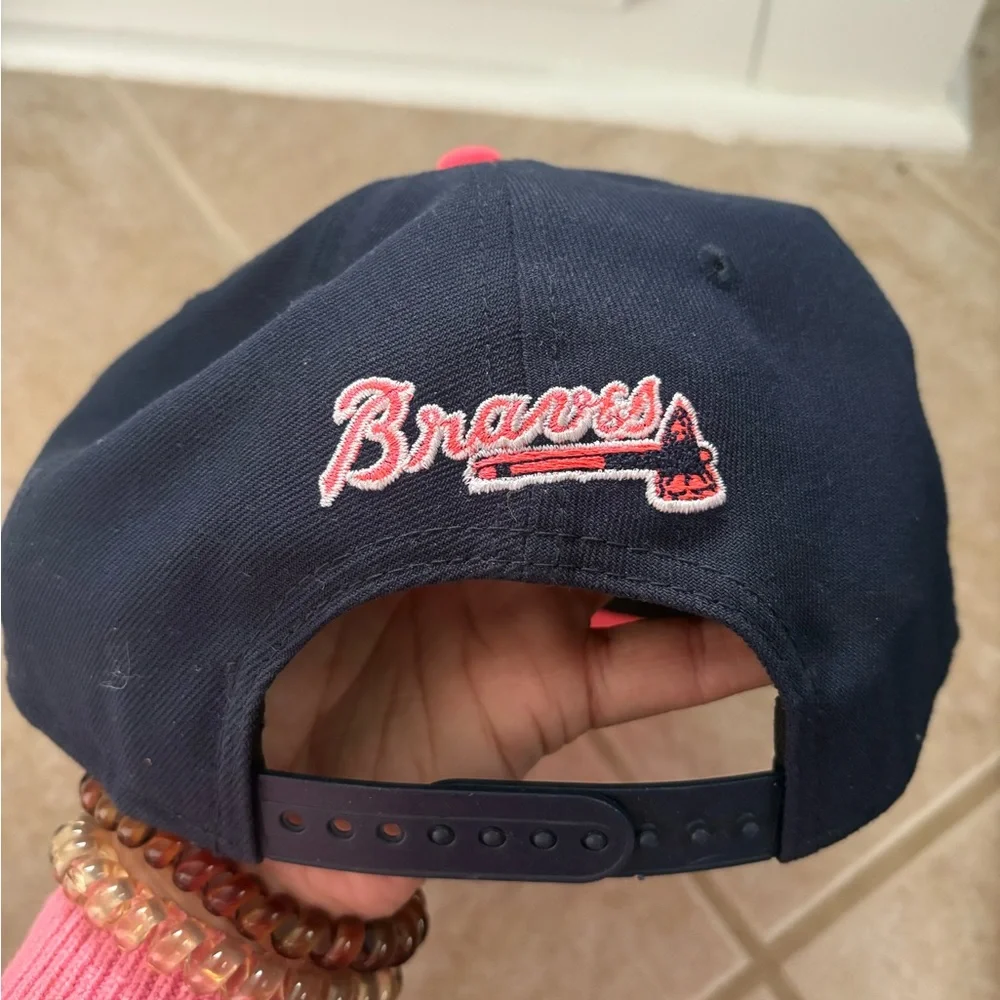New Era Atlanta Braves 9FIFTY snapback hat in navy and vibrant pink colorway